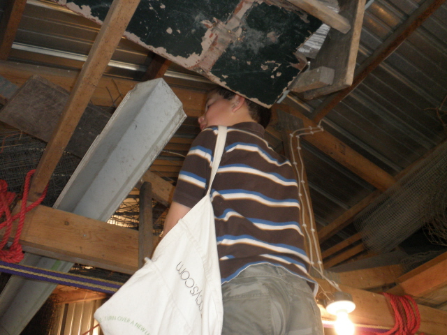 Caleb searching for Easter eggs in the barn.  