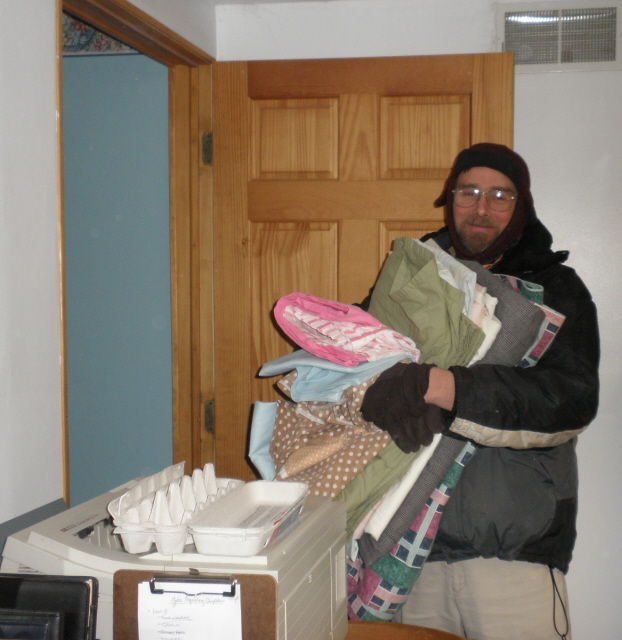 Gerald with sheets in hand off to the garden. 