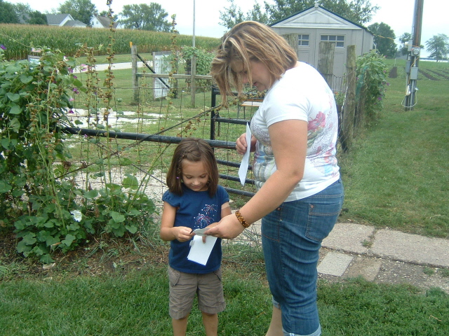 Laura helping Kelsey. 